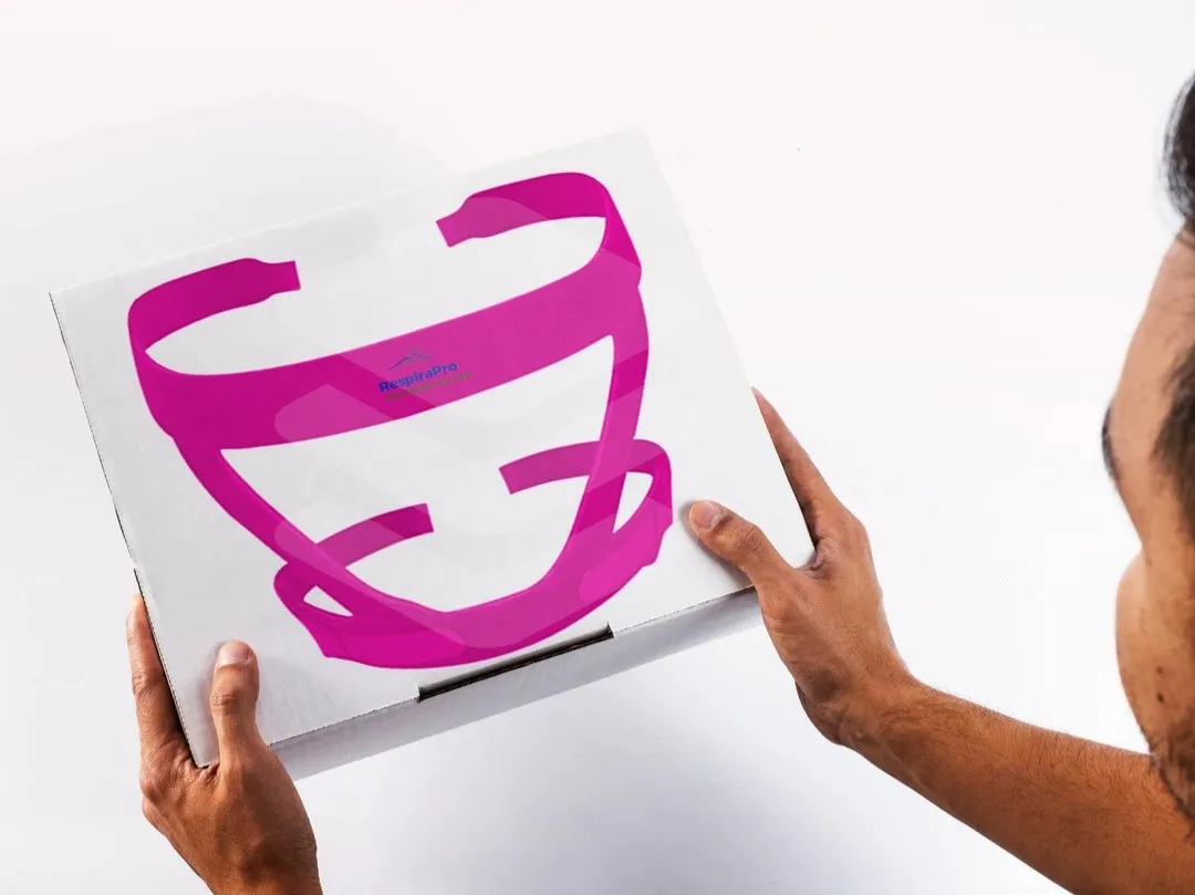 Pink RespiraPro CPAP headgear displayed on an original design mock-up